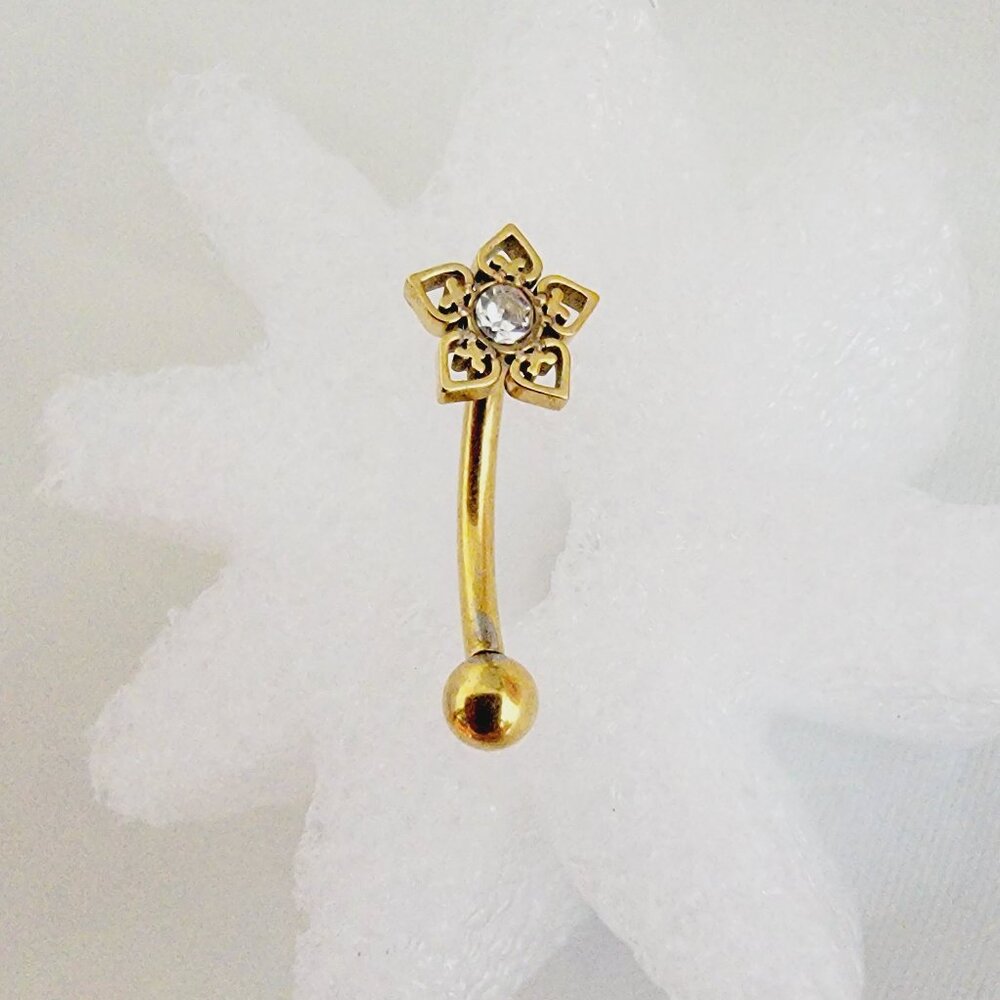 Decorative heart flower with clear CZ center 16g gold brow curved barbell